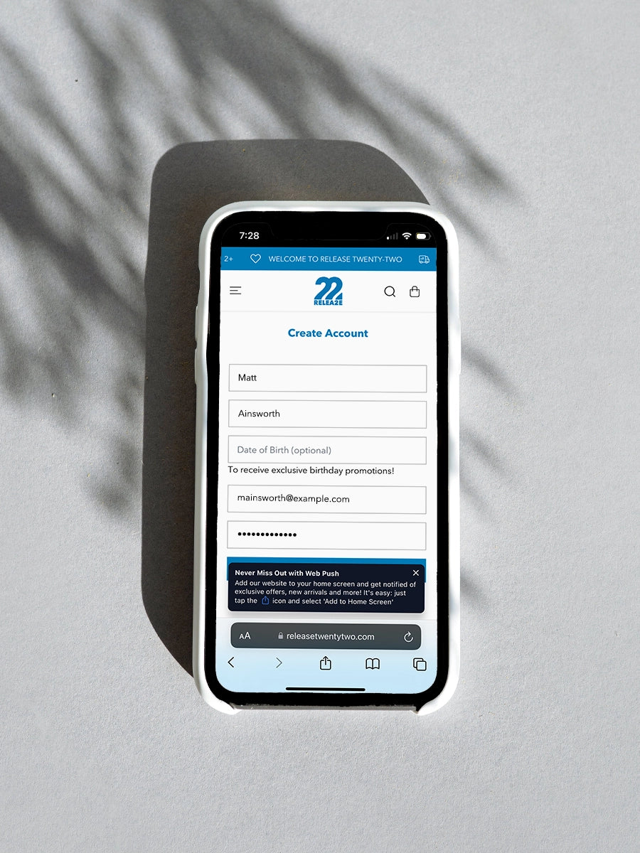 Image of a mobile phone showing the create an account page on the Release Twenty-Two mobile website